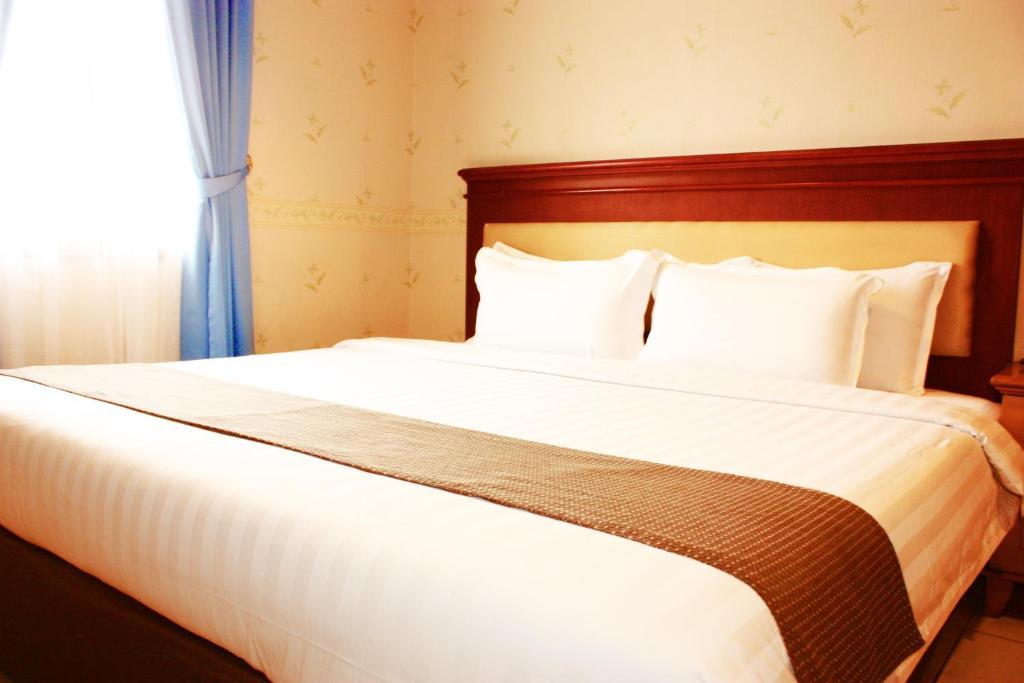 Travellers Suites Serviced Apartments Медан Номер фото