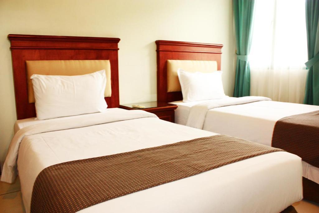 Travellers Suites Serviced Apartments Медан Номер фото