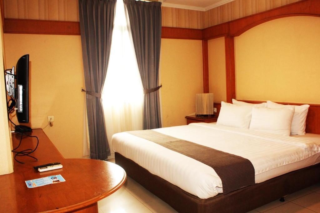 Travellers Suites Serviced Apartments Медан Номер фото